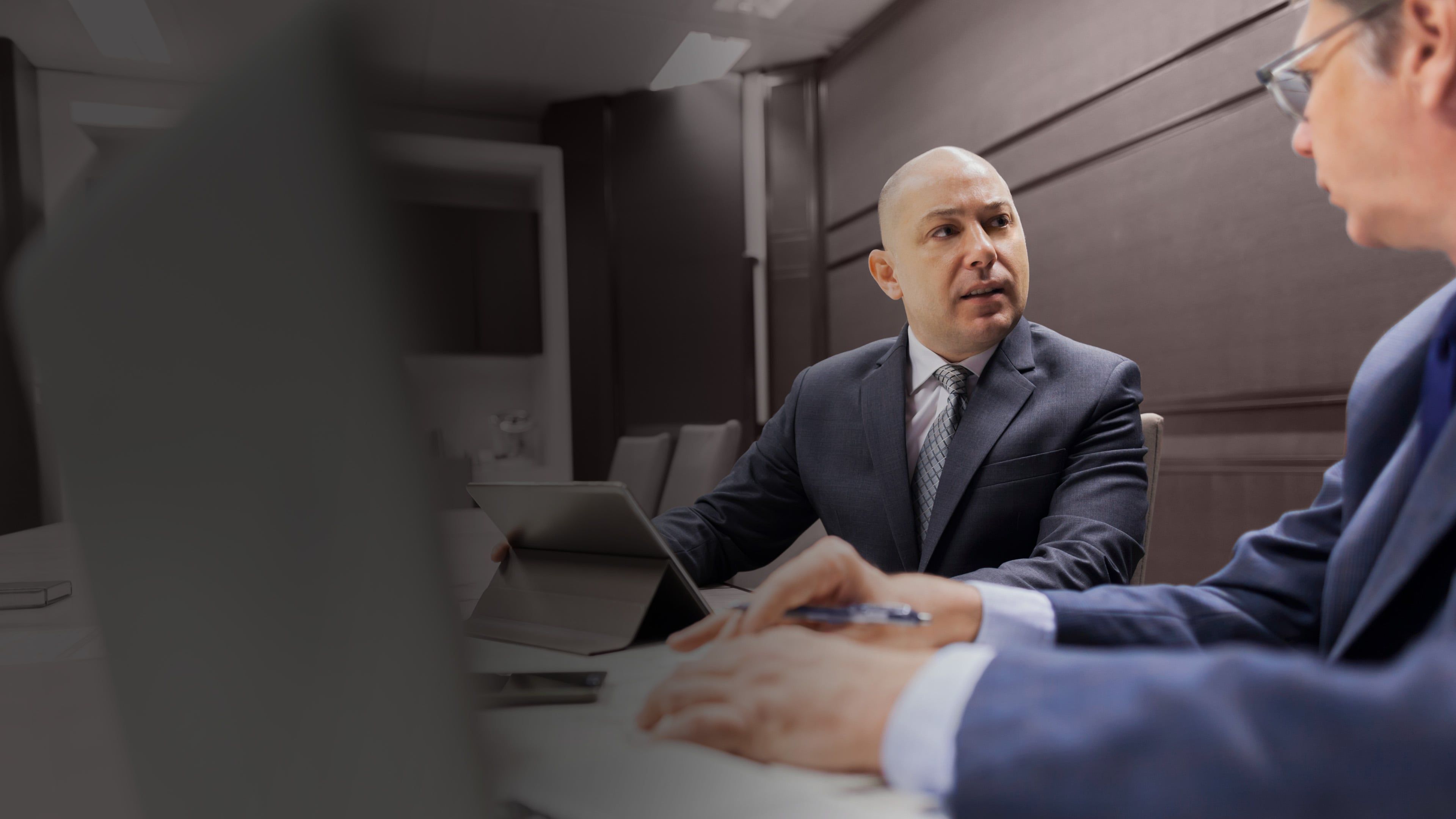 Private equity CEO in discussion with an advisor, representing leadership traps, board alignment, and the shifts needed to succeed in PE-backed environments.