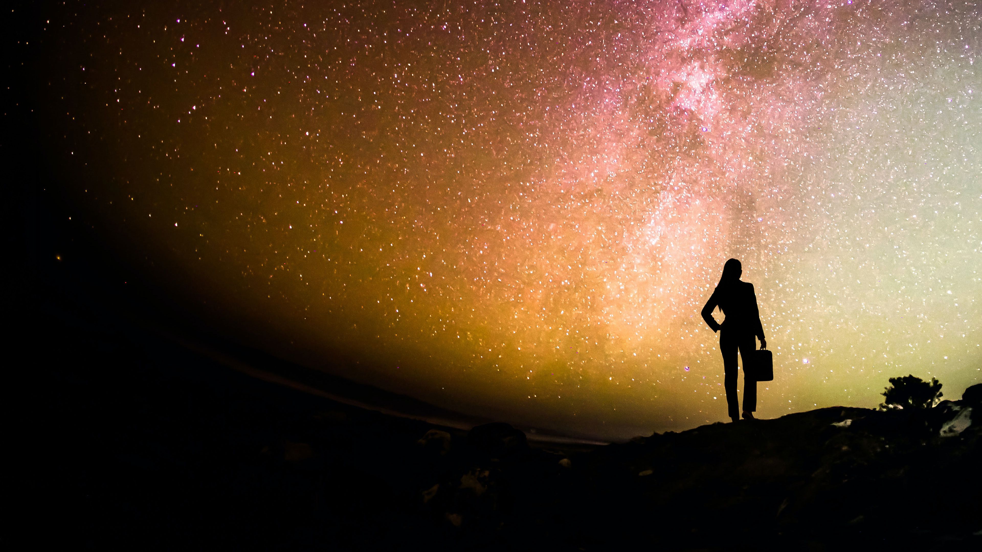 Business leader gazing at a starry night sky, illustrating enterprise leadership transformation.