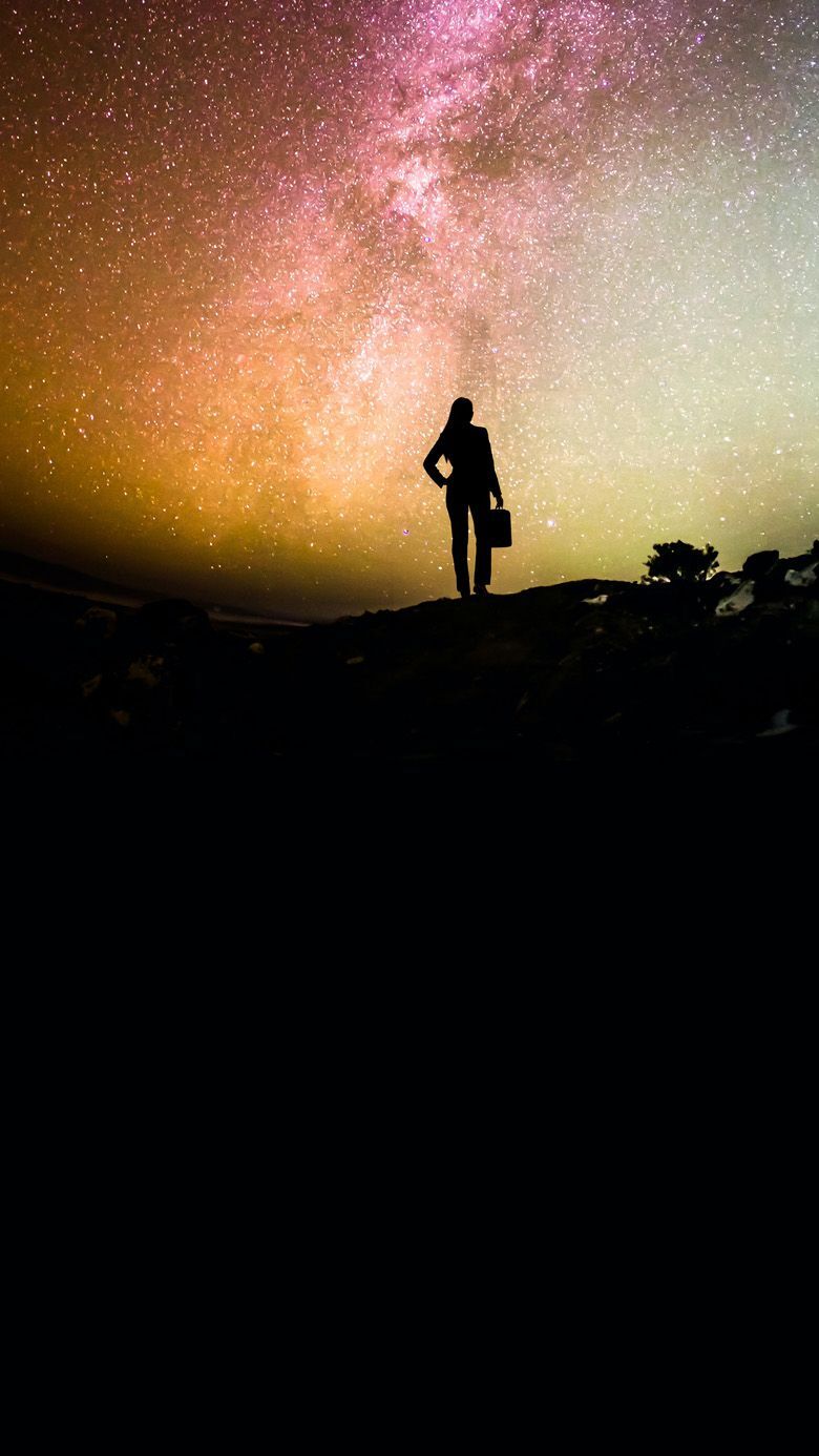 Executive silhouette under a starlit night sky for RHR's webinar on closing the enterprise leadership gap.