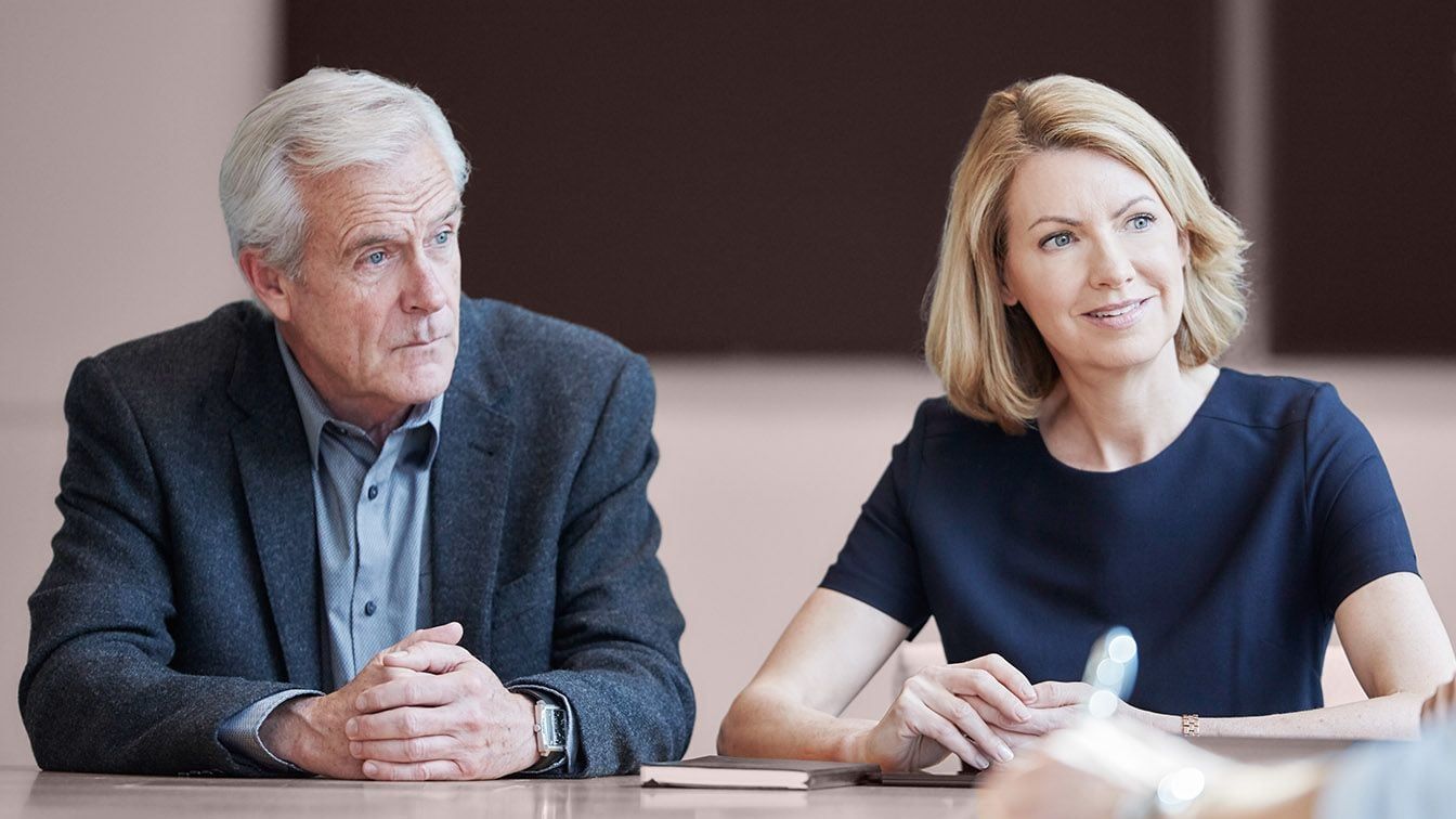 Two professionals engaged in discussion, reflecting RHR International’s long-standing commitment to leadership advisory, executive assessment, and helping organizations navigate critical business decisions.
