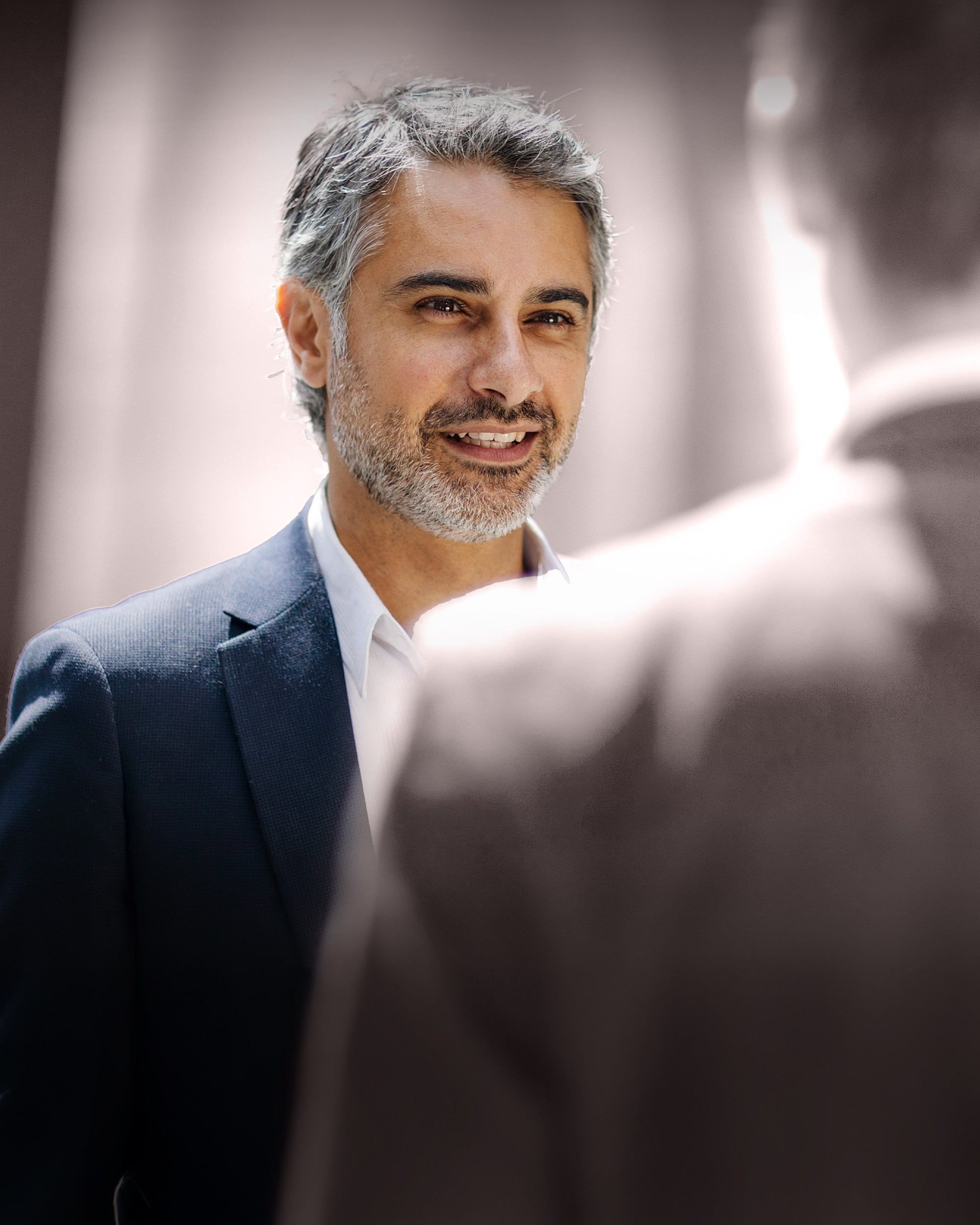 Senior leader engaged in conversation, illustrating RHR’s succession planning approach by identifying and preparing future leaders, building leadership pipelines, and helping organizations ensure continuity through leadership transitions.