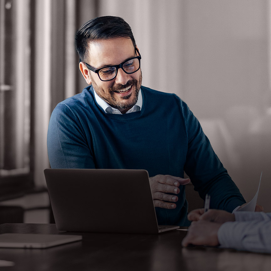 Assessment and Benchmarking image of a business leader in conversation, representing data-led executive assessment and leadership insight.