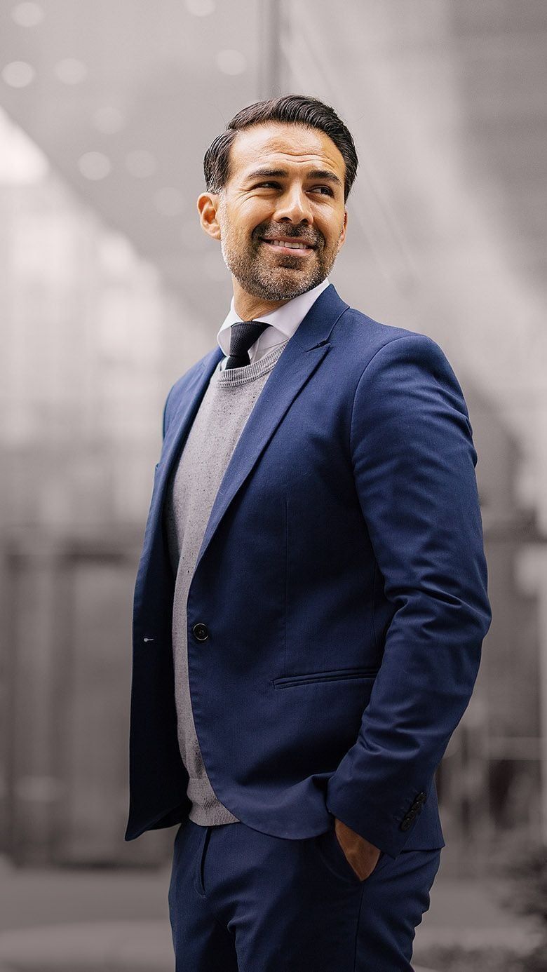Mobile banner image of a professional businessman in a corporate setting, representing confidence, future leadership potential, and RHR’s Emerging Talent Solutions.