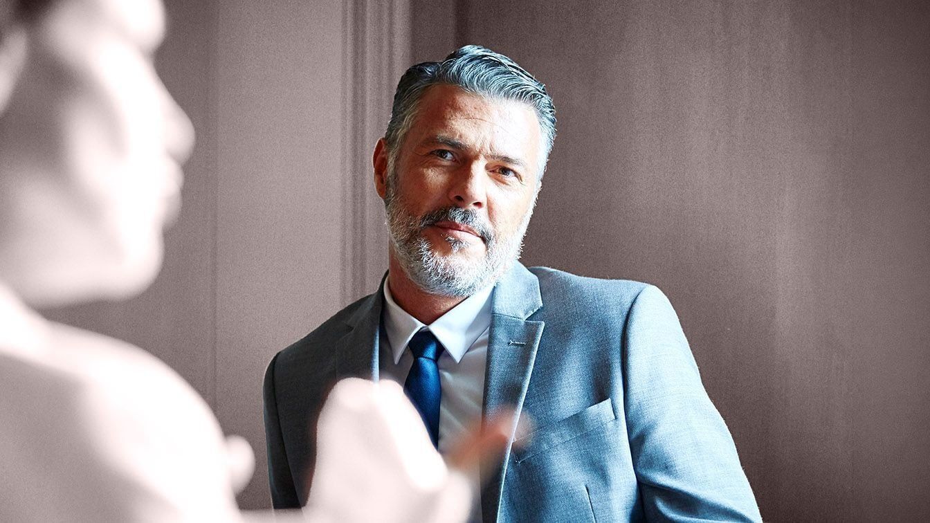 Image of a senior business executive during a leadership discussion, representing executive transition, succession planning, and RHR’s CEO Succession services.