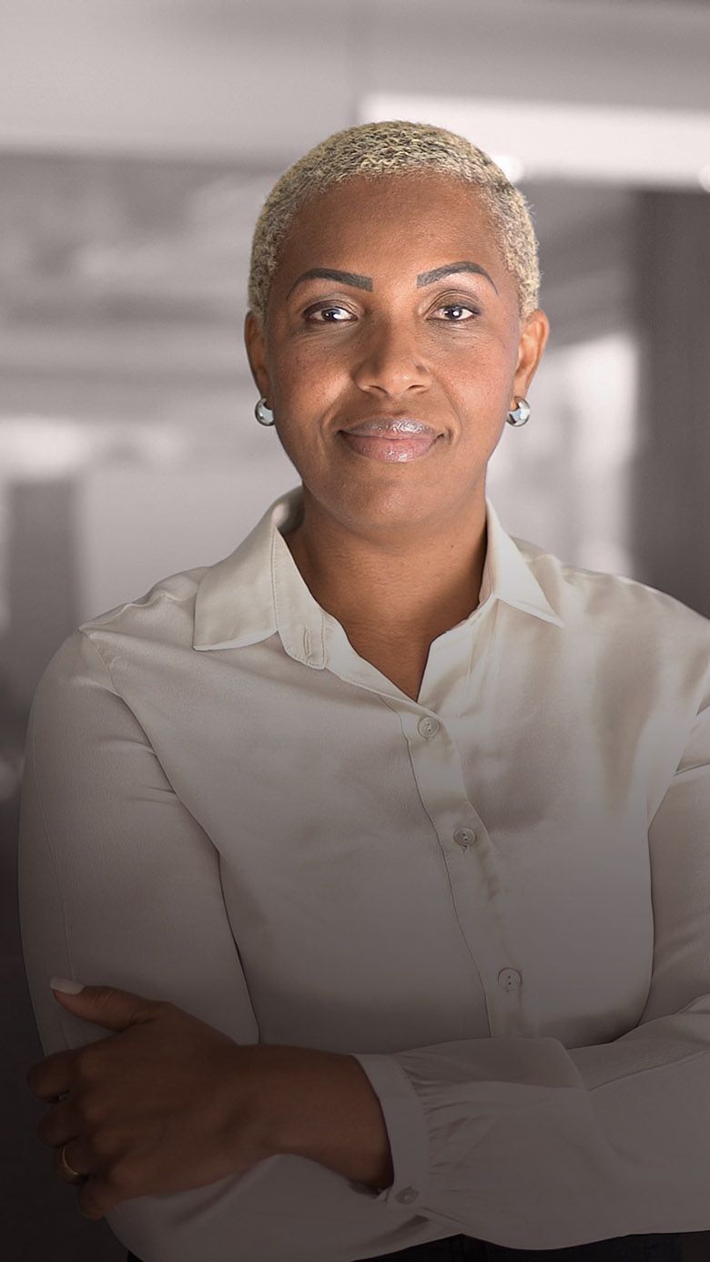 Portrait image of a professional businesswoman in a corporate setting, representing executive onboarding, leadership transition, and RHR’s CEO Transition services.