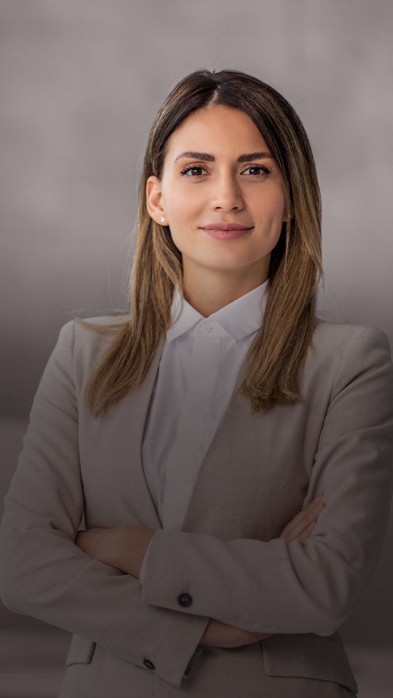 Portrait image of a professional businesswoman in a corporate setting, representing executive coaching, leadership development, and RHR’s C-Suite Advisory Coaching Solutions.