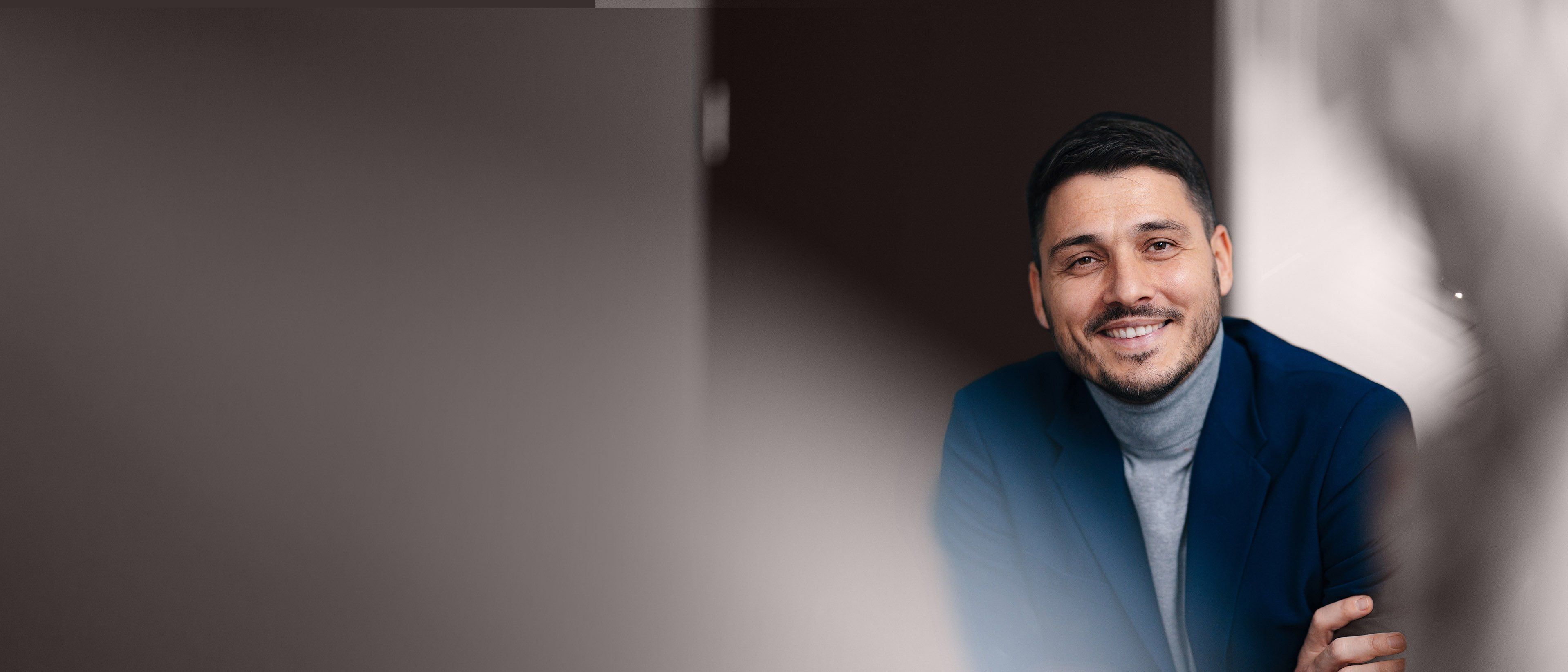 Wide banner image of a professional business leader in a corporate setting, representing leadership growth, executive coaching, and RHR’s Coaching and Development Programs.