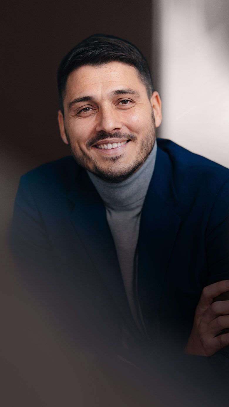 Portrait image of a professional business leader in a corporate setting, representing leadership growth, executive coaching, and RHR’s Coaching and Development Programs.