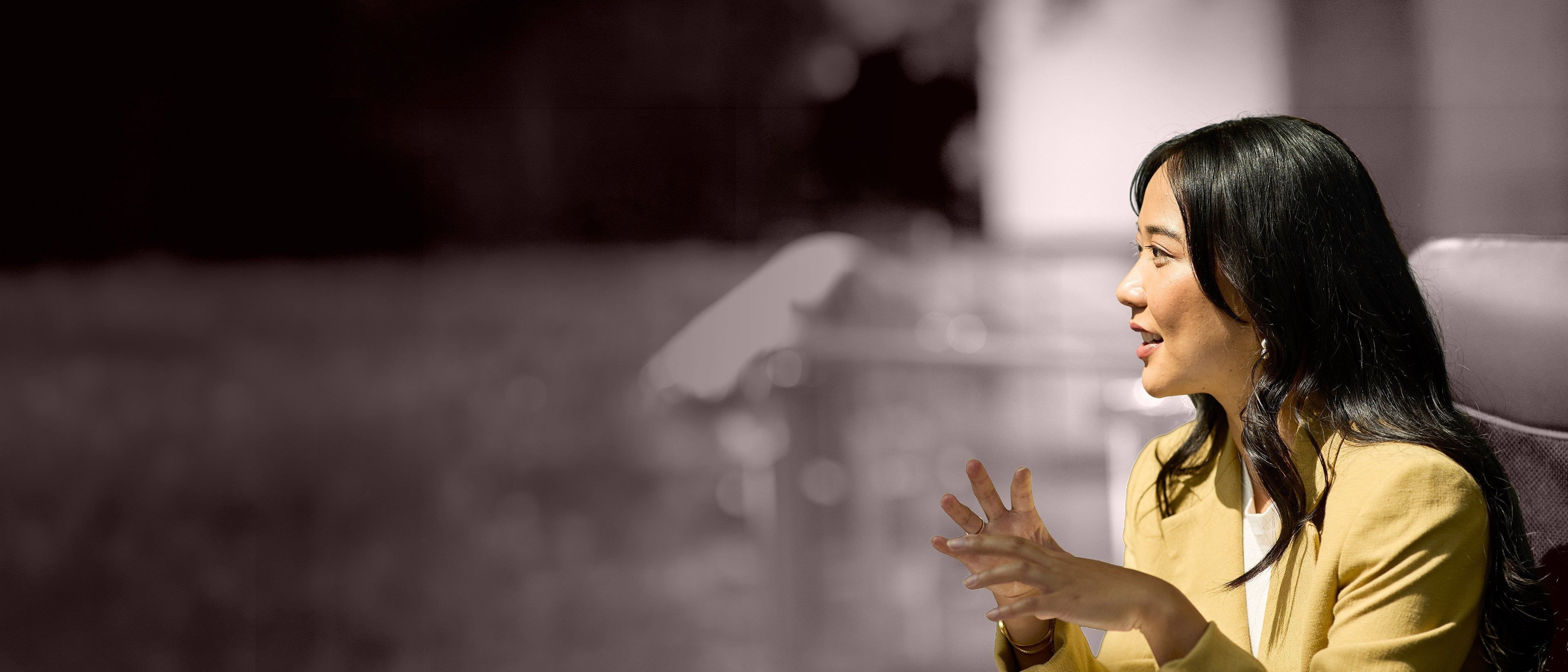 Wide banner image of a business professional engaged in discussion, representing leadership growth, strategic communication, and RHR’s Leadership Coaching services.