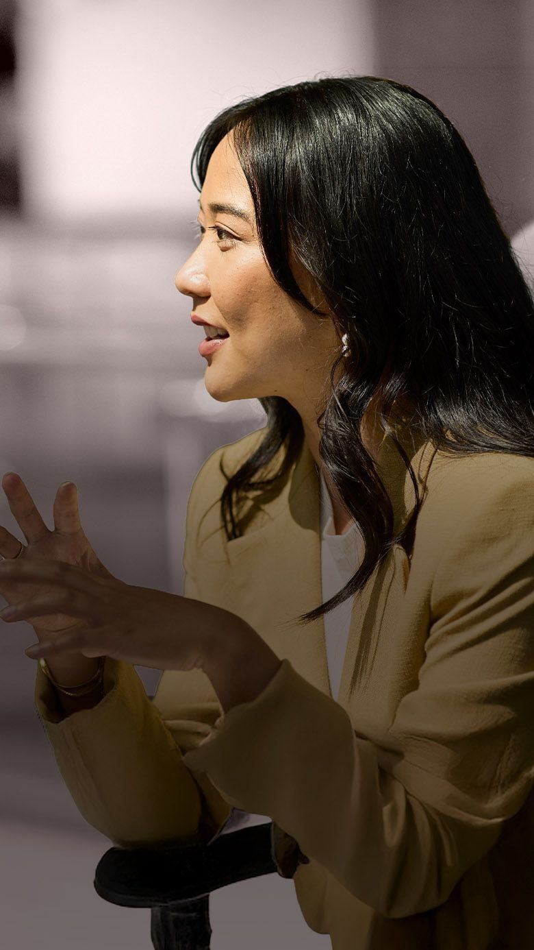 Portrait image of a business professional engaged in discussion, representing leadership growth, strategic communication, and RHR’s Leadership Coaching services.