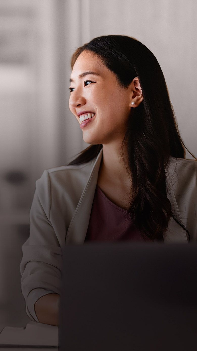 Portrait image of a professional businesswoman in a corporate setting, representing executive onboarding, leadership integration, and RHR’s Onboarding and Transition Services.