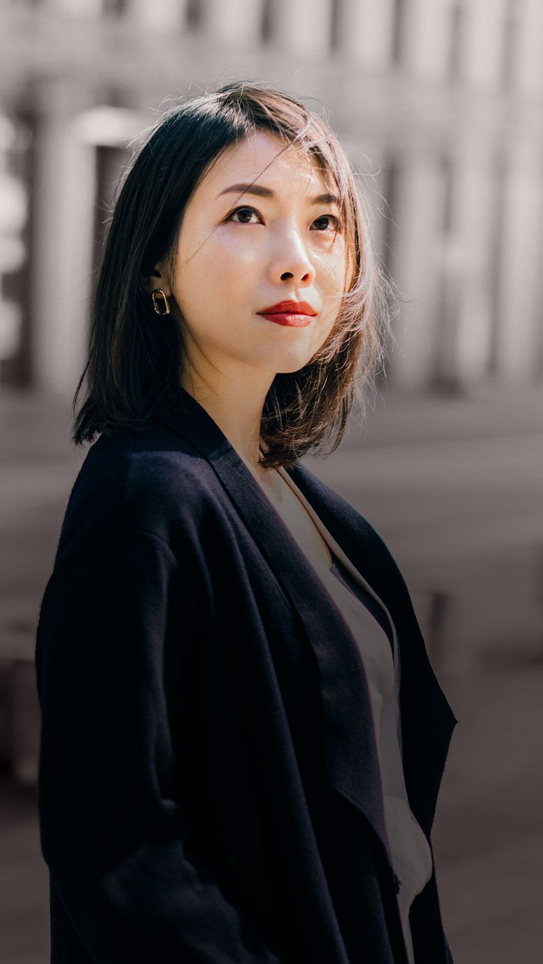 Portrait image of a business professional in an urban setting, representing leadership transition, organizational change, and RHR’s M&A Talent Moves solutions.