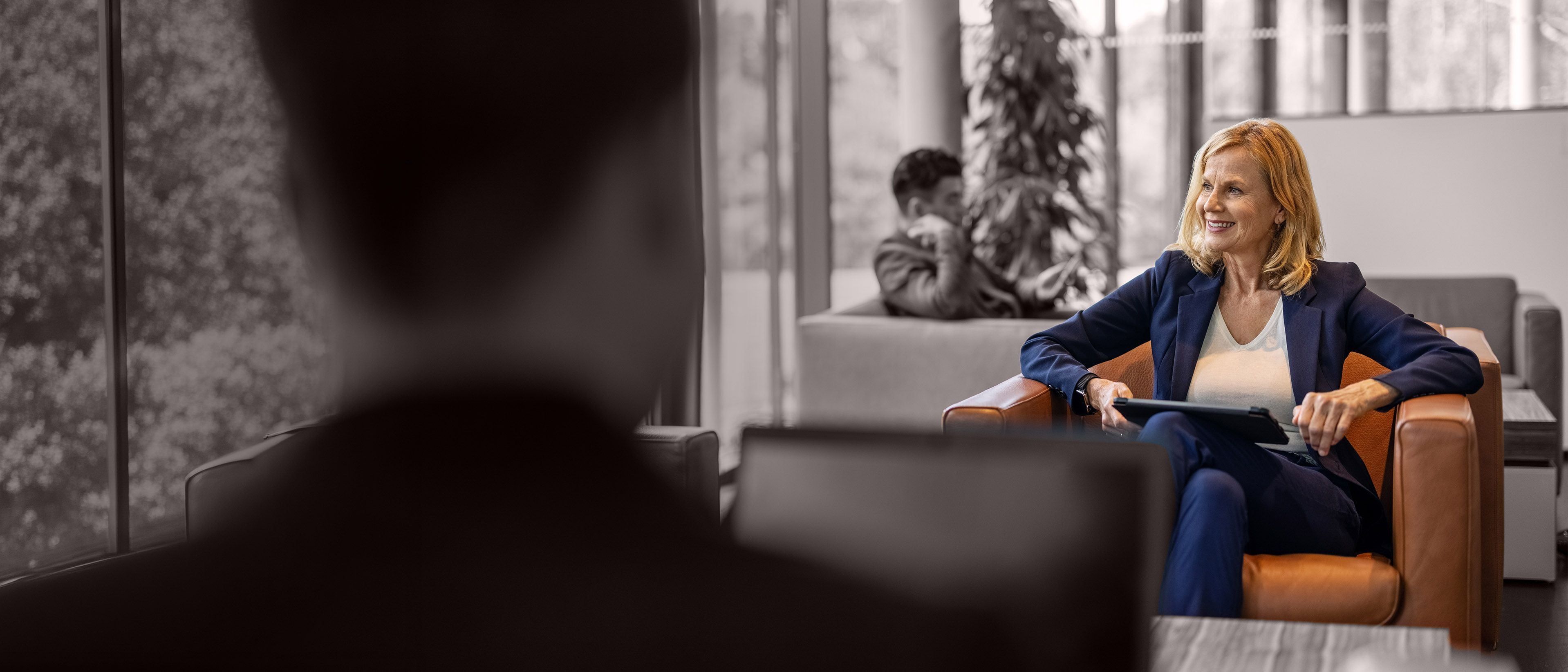 Wide banner image of a business leader in conversation during a professional meeting, representing leadership pipeline planning, succession readiness, and RHR’s Succession Planning Getting Started Solutions.