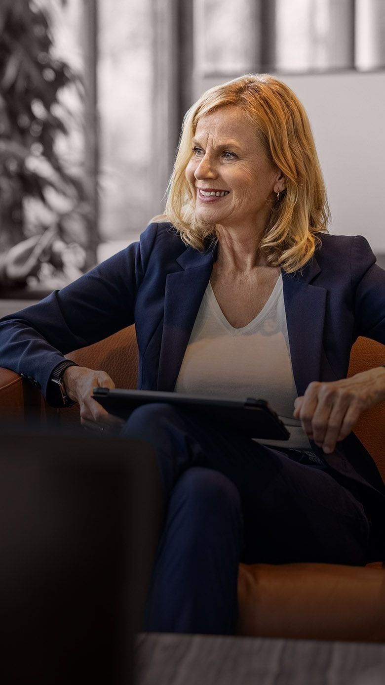 Portrait image of a business leader in conversation during a professional meeting, representing leadership pipeline planning, succession readiness, and RHR’s Succession Planning Getting Started Solutions.
