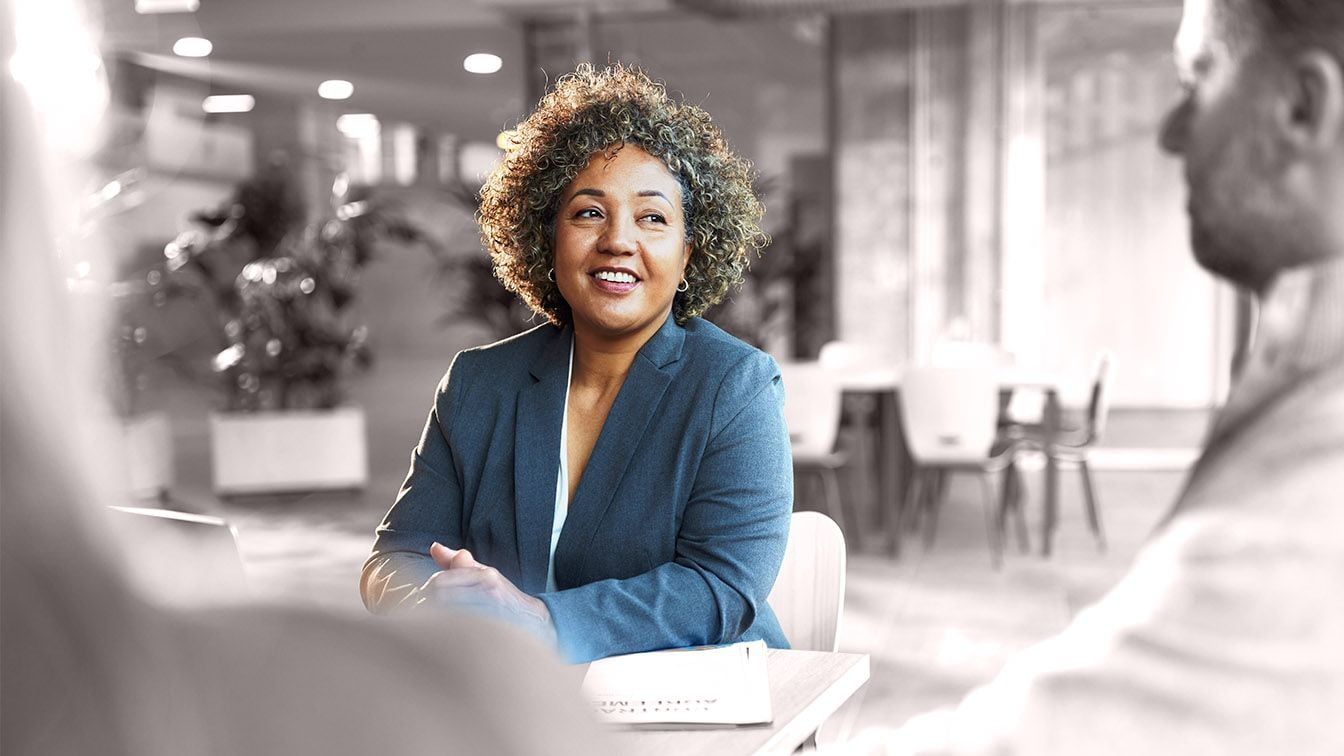 Image of a business professional engaged in a leadership discussion, representing talent identification, leadership potential, and succession readiness through RHR’s Succession Planning and Identifying Talent Solutions.