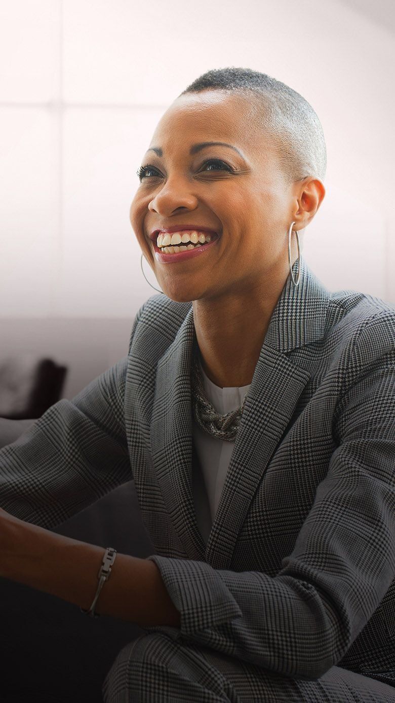 Portrait image of a business professional in discussion, representing leadership role definition, talent alignment, and succession readiness through RHR’s Succession Planning and Role Profiling Solutions.