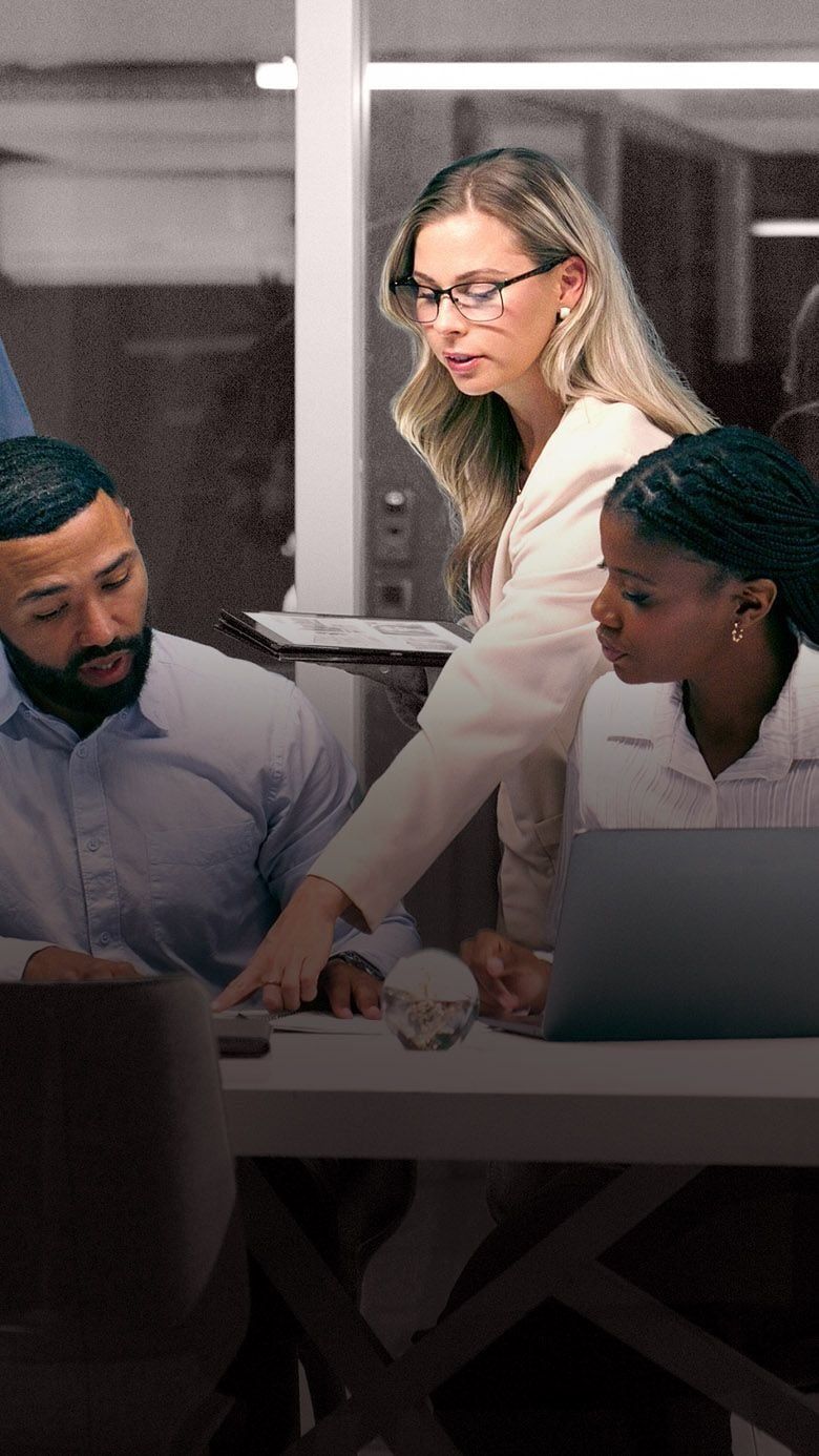 Portrait image of business professionals collaborating during a planning session, representing team formation, leadership alignment, and RHR’s Launching New Teams Solutions.